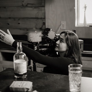 a lady behind the lens